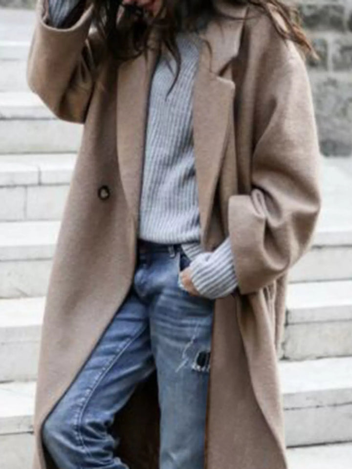 White oversized women's long coat, a stylish outerwear essential for elegant winter fashion.