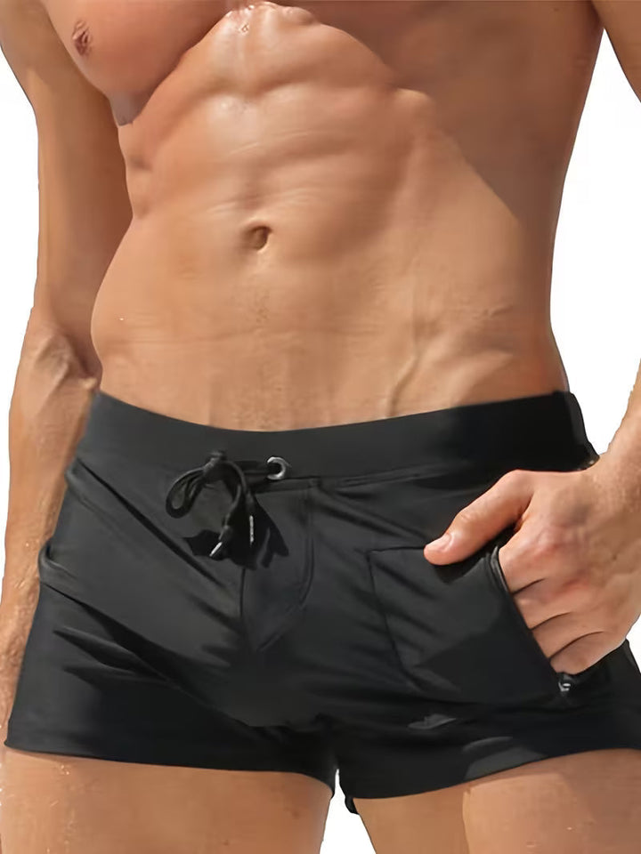 Men's modern boxer swim trunks with a practical zipper pocket, perfect for quick-dry beachwear and summer style.