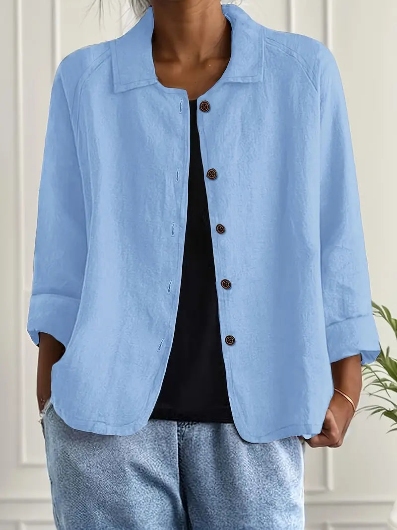 Classic women's collared button-down blouse with three-quarter sleeves for versatile wear.
