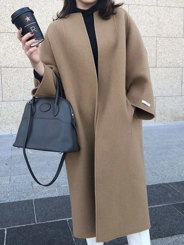 Elegant women's long winter coat, perfect for adding warmth and sophistication to any outfit.