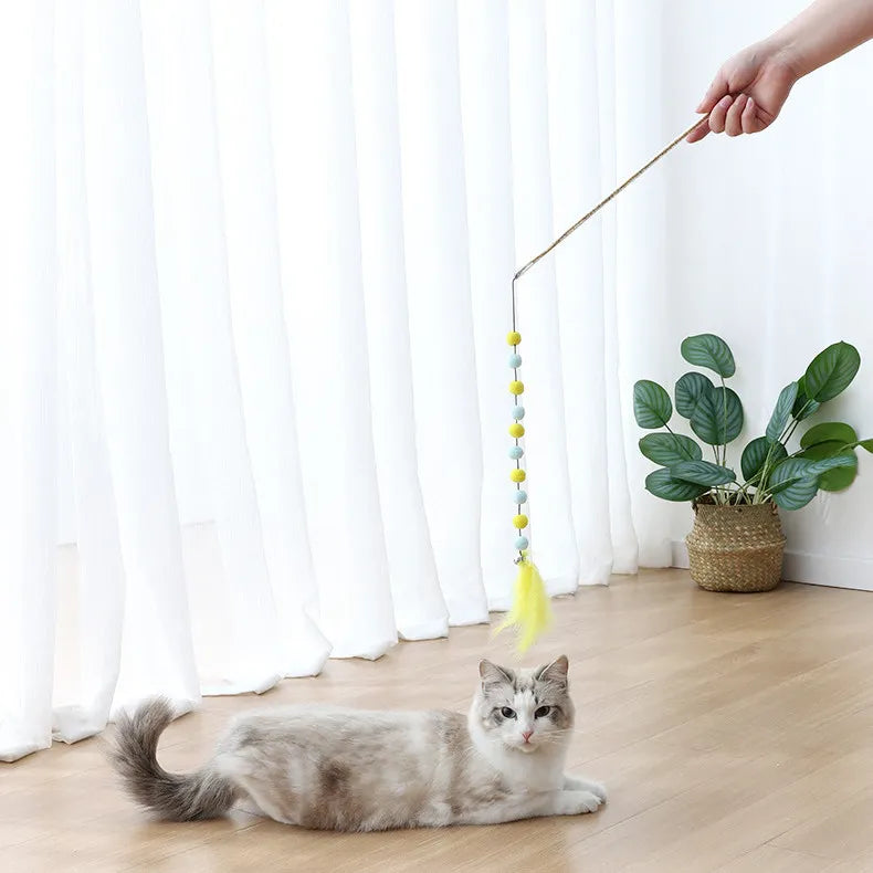 Interactive cat wand toy with a long flexible rod & string, stimulating playful felines for active play.
