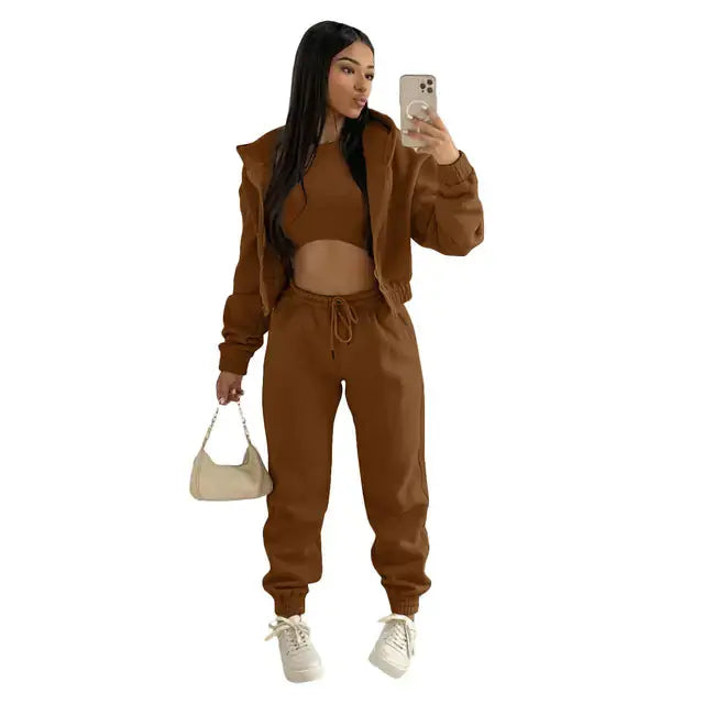 Cozy women's 3-piece loungewear: cropped hoodie, joggers, & bralette for ultimate relaxation.