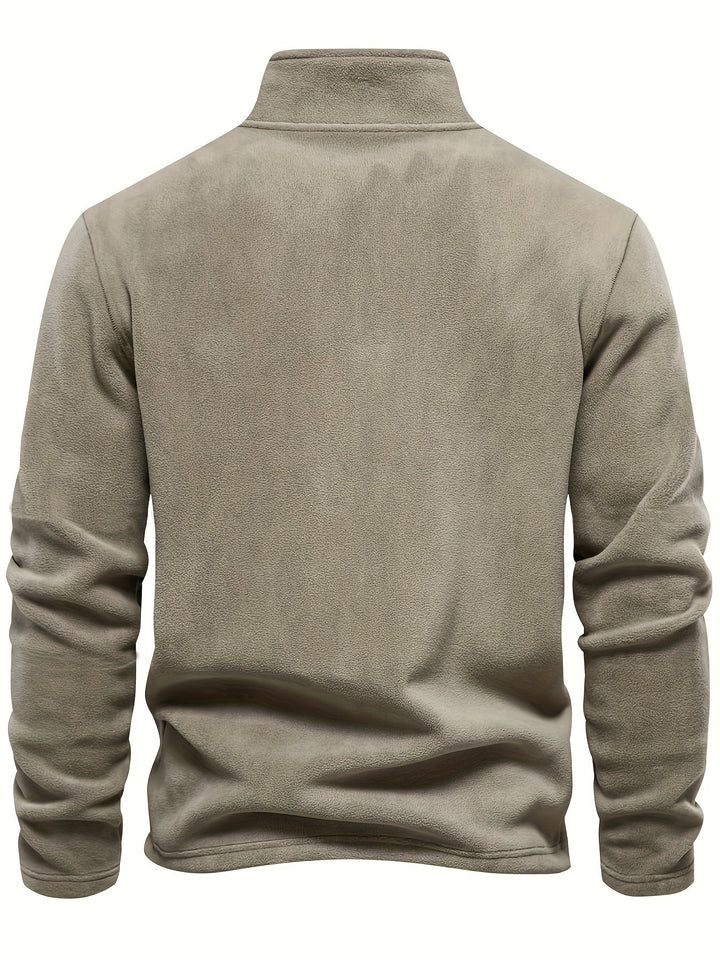 Fall fashion essential: unisex half-zip pullover. Fleece-lined comfort, perfect for chilly weather layering.