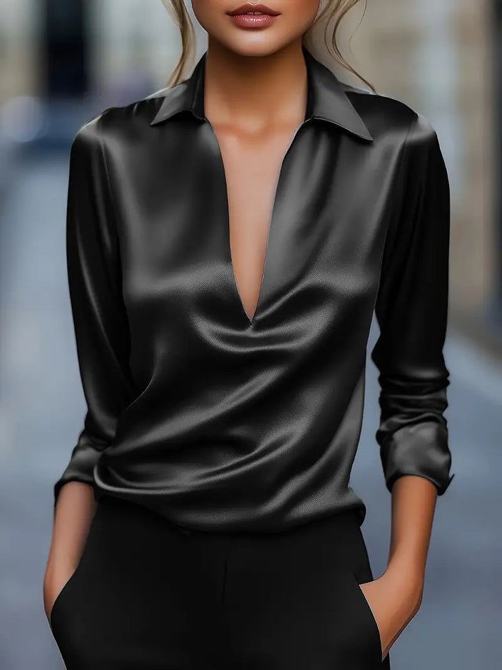 Casual yet elegant women's long sleeve V-neck blouse. Collared design adds a sophisticated touch to outfits.