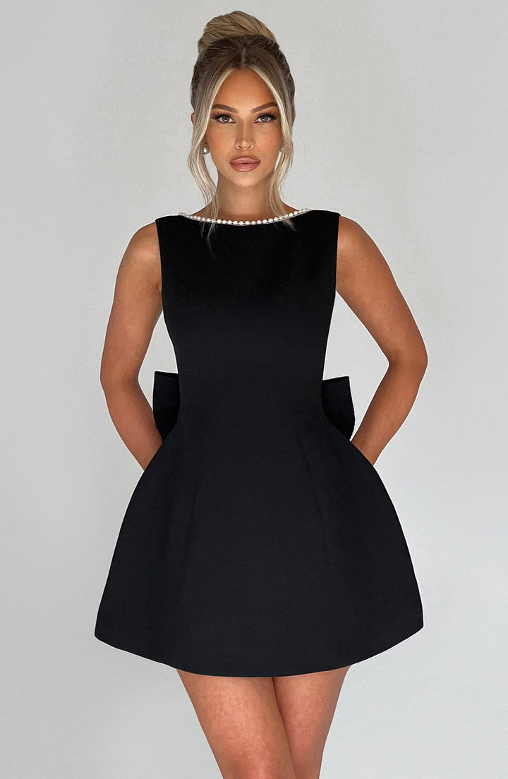 Figure-flattering women's mini dress, sleeveless, with a chic pearl neck detail.