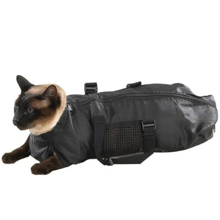 Pet grooming aid: see a cat comfortably secured in a mesh bag for a quick and safe claw trimming session.