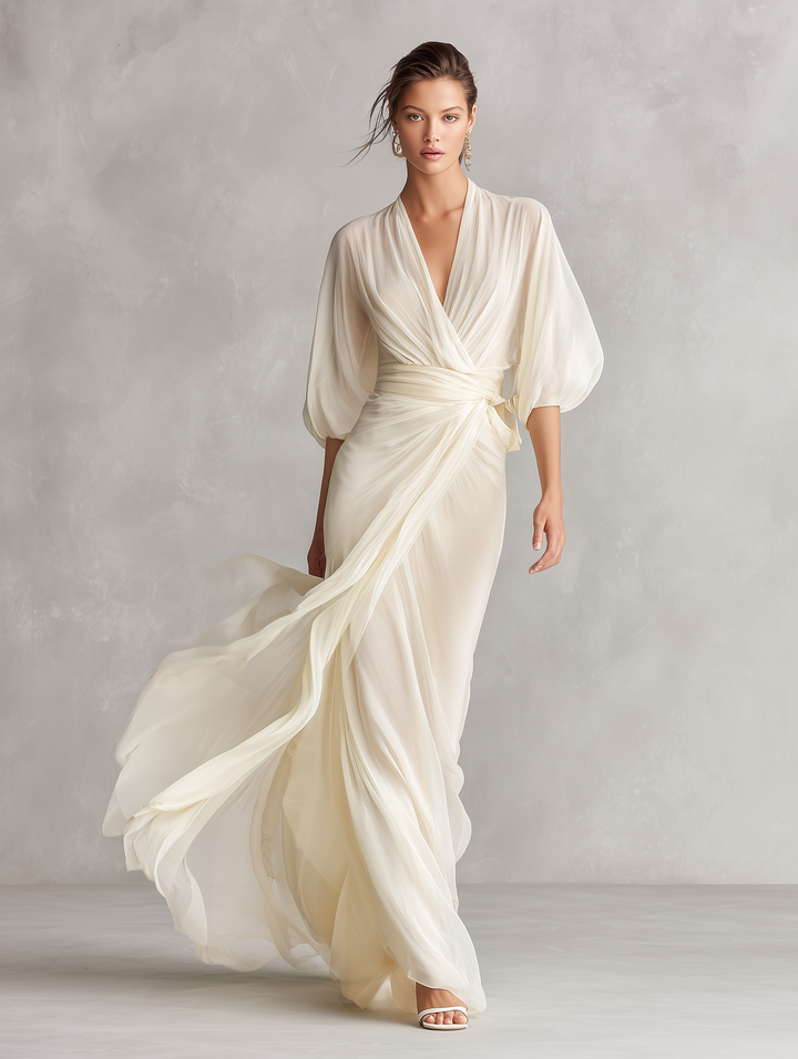 Sophisticated ivory wrap maxi dress for women, with sheer fabric & timeless puff sleeves; ideal for special occasions.