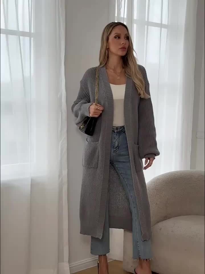 Cosy V-neck knit cardigan with elegant buttons & soft texture, perfect women's winter wear.