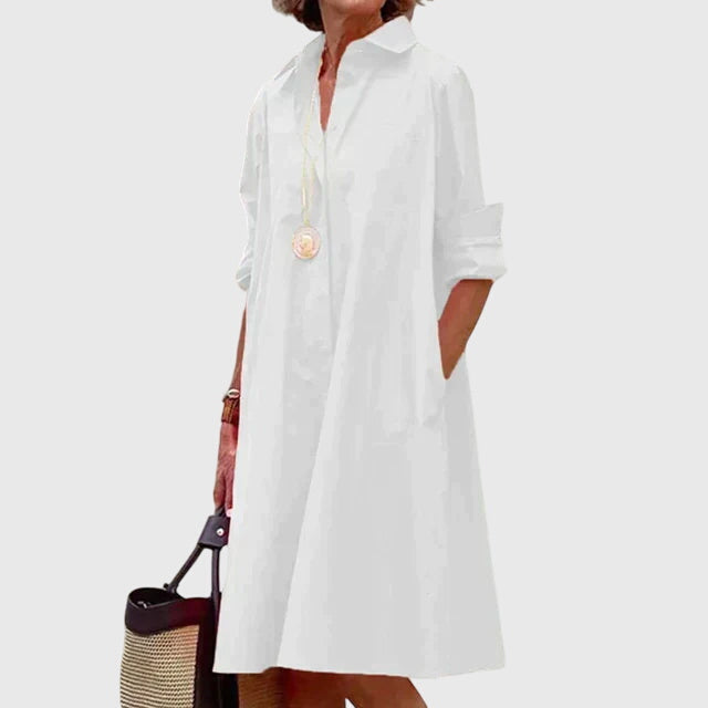 Model smiling in a chic long sleeve casual elegant dress, ideal for versatile everyday wear.