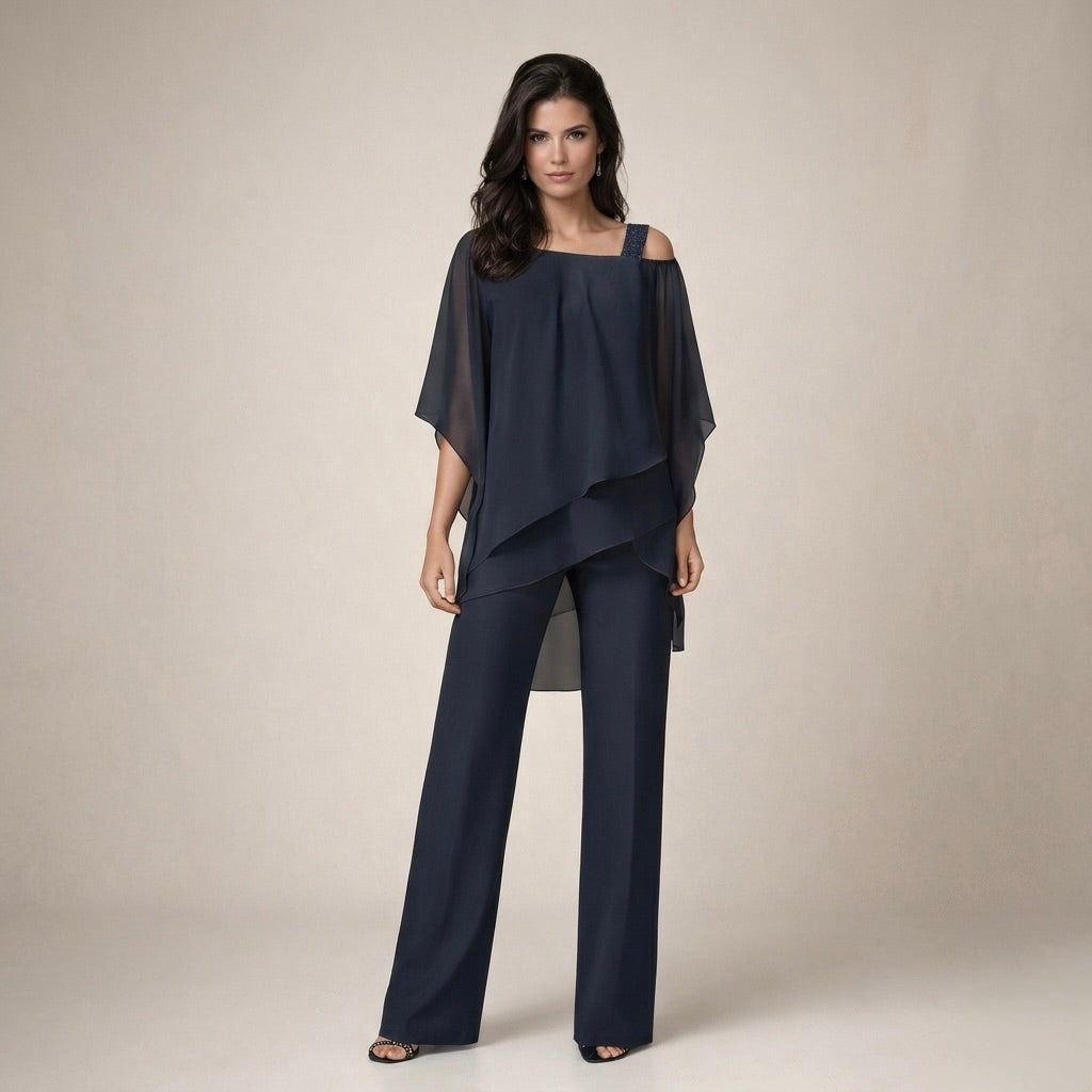 Elegant women's off-shoulder two-piece summer outfit. Lightweight matching top and shorts for casual fashion.
