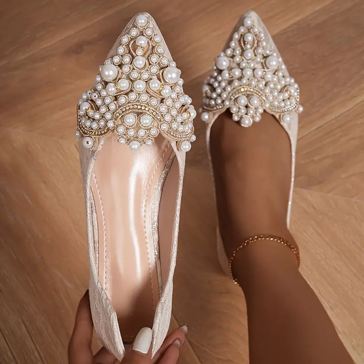 Elegant women's bridal ballet flats with delicate lace overlay & pearl embellishments, perfect for weddings & special occasions.