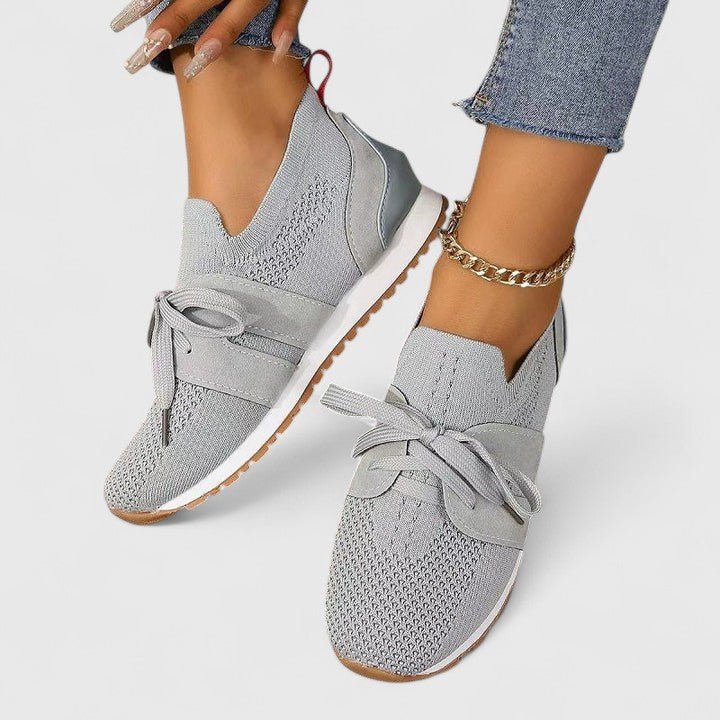 Slip-on women's orthopaedic sneakers offering superior arch support for comfortable everyday wear.