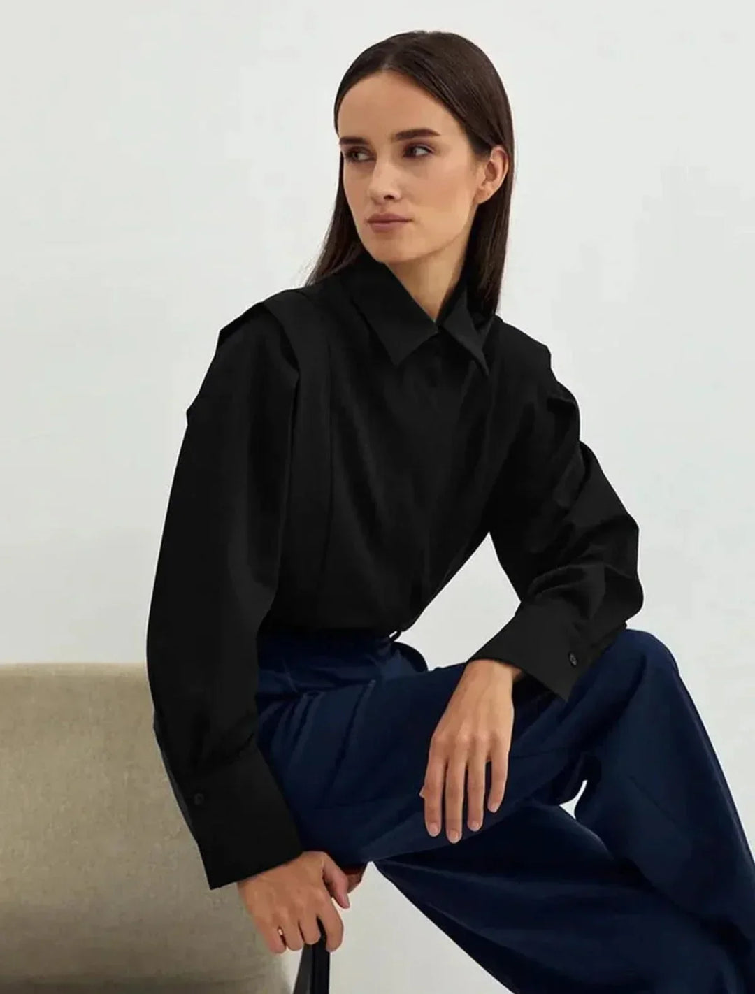 Stylish women's boxy button-down blouse, versatile for office wear or casual chic modern fashion.