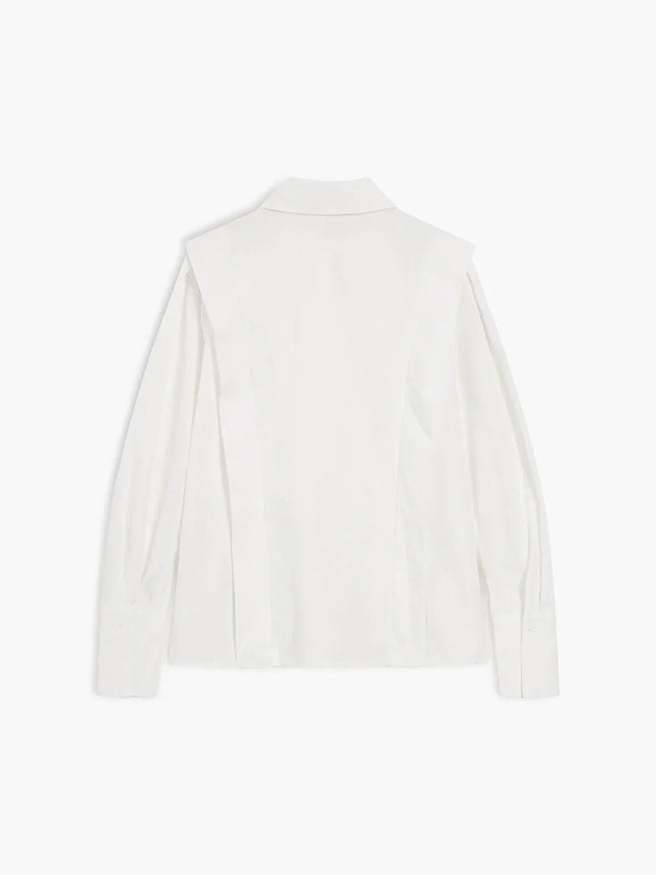 Modern women's boxy button-down blouse, a stylish & versatile shirt for office or casual chic.