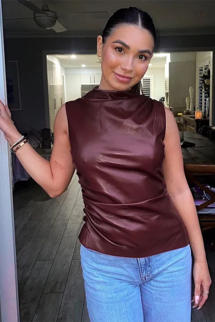 Lightweight women's brown sleeveless high neck summer top. Chic and versatile for smart casual outfits.