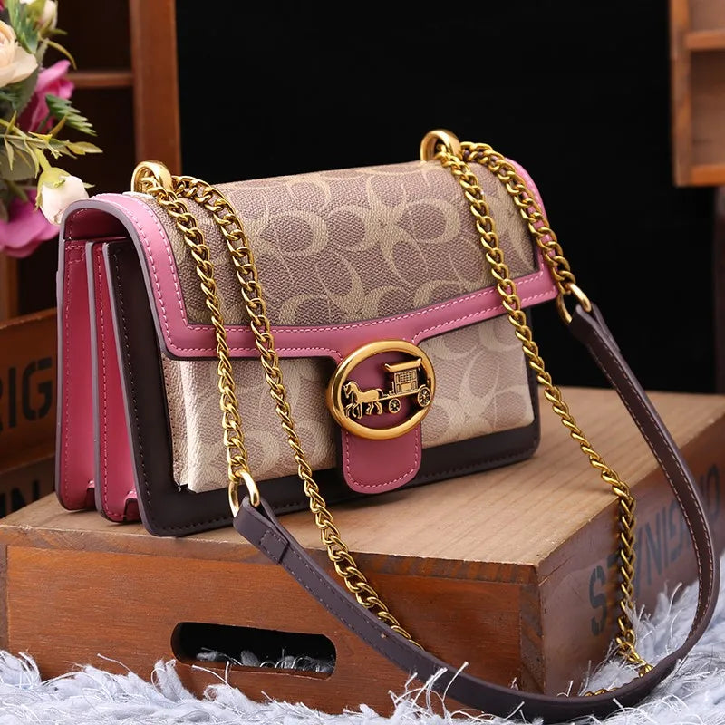 Chic women's colorblock crossbody bag with elegant gold chain, perfect for everyday fashion.