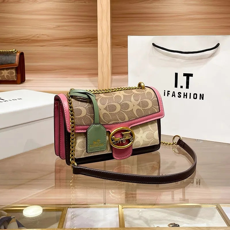 Designer colorblock mini purse for women with a stylish gold chain. Versatile shoulder bag.
