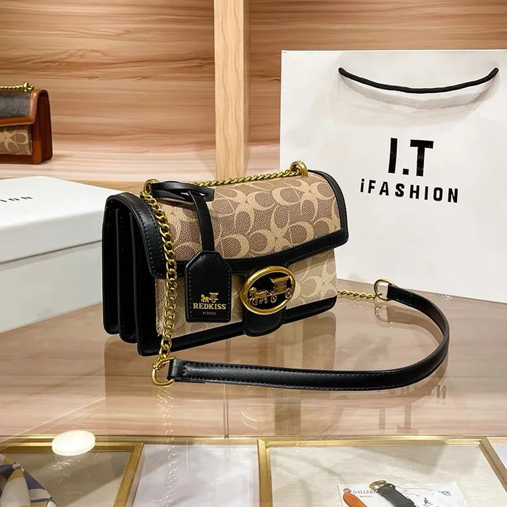 Fashionable women's colorblock mini purse, a versatile crossbody bag with a gleaming gold chain strap.