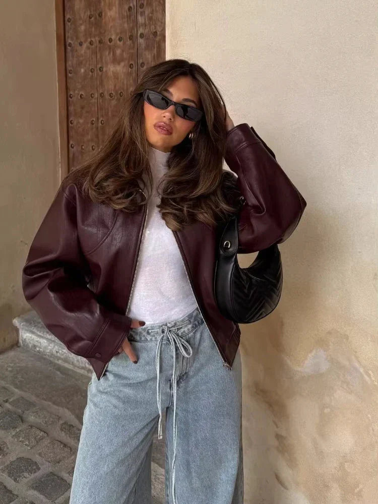 Chic women's oversized waist-length urban leather jacket, perfect for casual spring/autumn fashion.