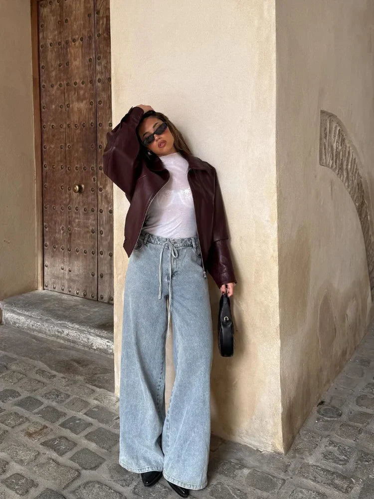 Oversized waist-length women's urban leather jacket, a chic and casual outerwear piece for modern style.