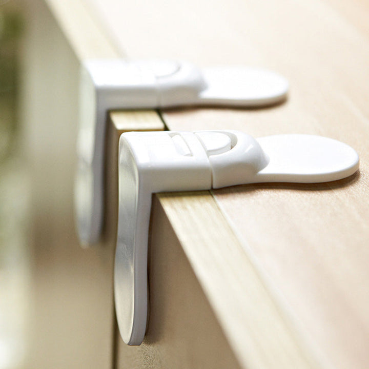 White adhesive child safety lock for cabinets & drawers. Ideal for baby proofing home. Secure & discreet.