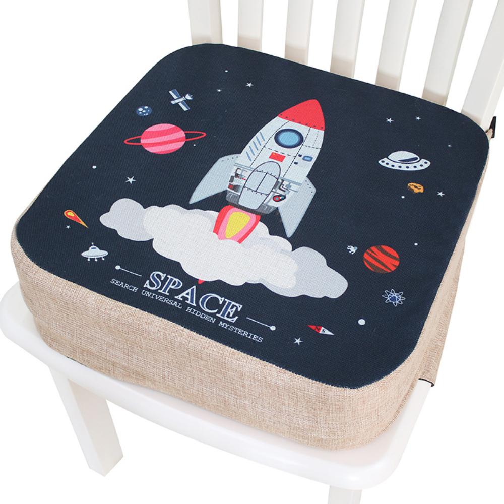 Portable toddler booster seat cushion for dining chairs, providing safety & comfort during family meals.