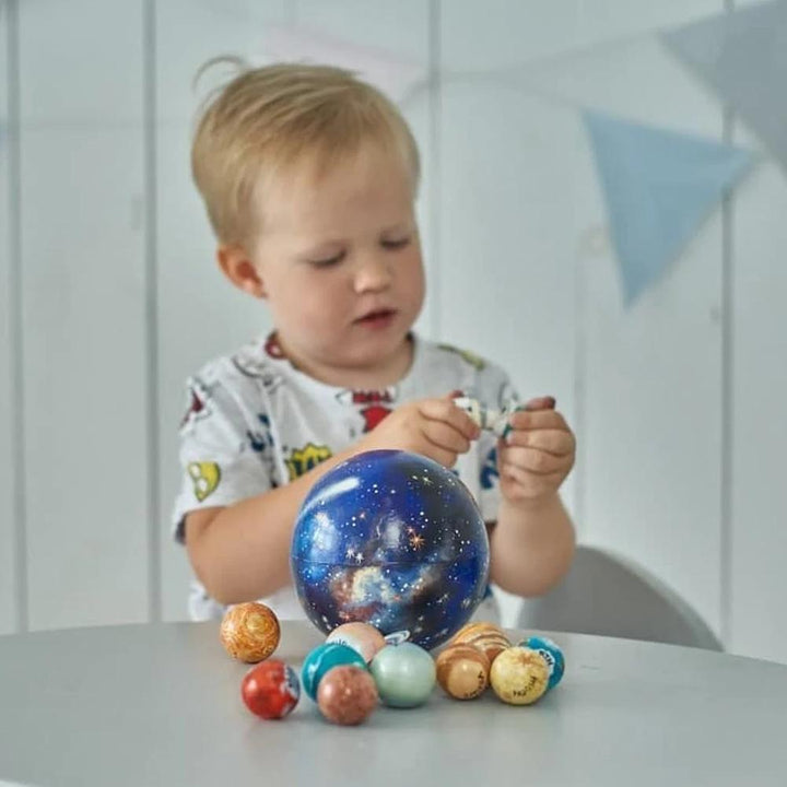 Vibrant wooden solar system toy for kids' activity. Educational planet set for learning about space & astronomy.