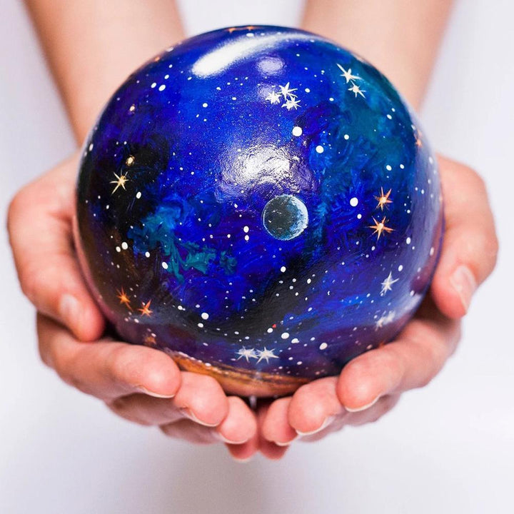 Colorful wooden planet set for children. An educational solar system learning game for young explorers to discover space.