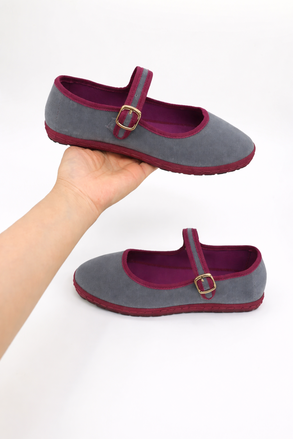 Durable ladies' ballet flats in black with a secure buckle strap and comfy round toe for any outfit.