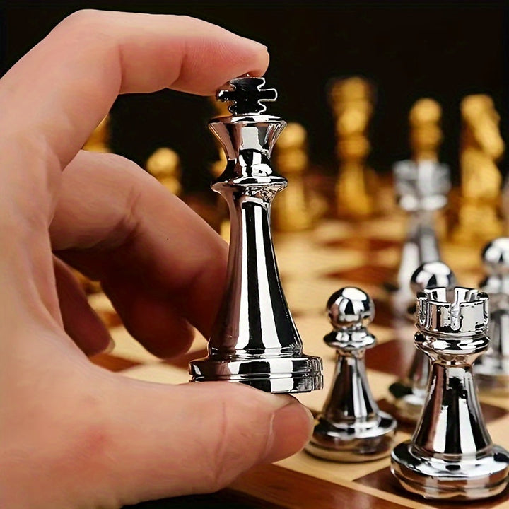 Vintage luxury wooden chess set with finely crafted metal pieces. Classic foldable board game for travel.