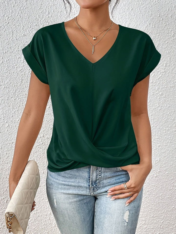 Chic women's casual V-neck top, a relaxed fit essential for comfortable everyday style. Perfect for spring/summer.
