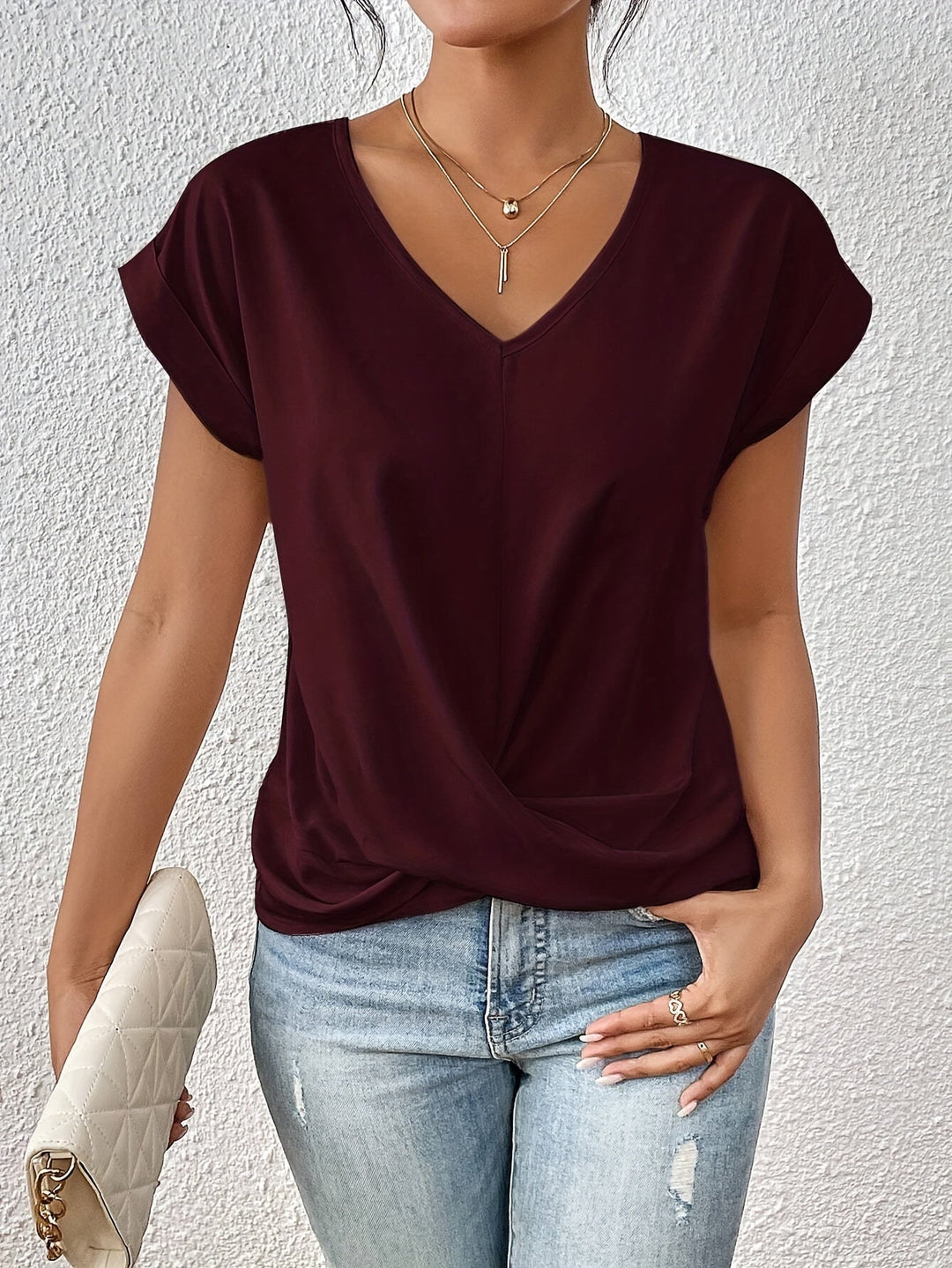 Stylish women's V-neck top with a relaxed fit, great for spring fashion & versatile daily outfits. Comfortable & chic.