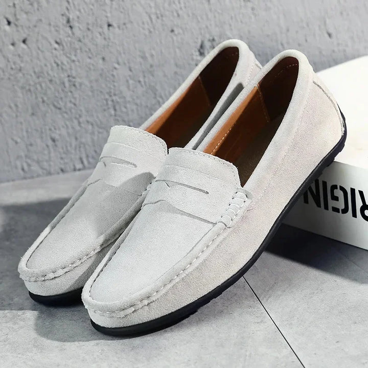 Men's timeless black penny loafers, featuring a comfortable slip-on design for versatile spring-summer fashion.