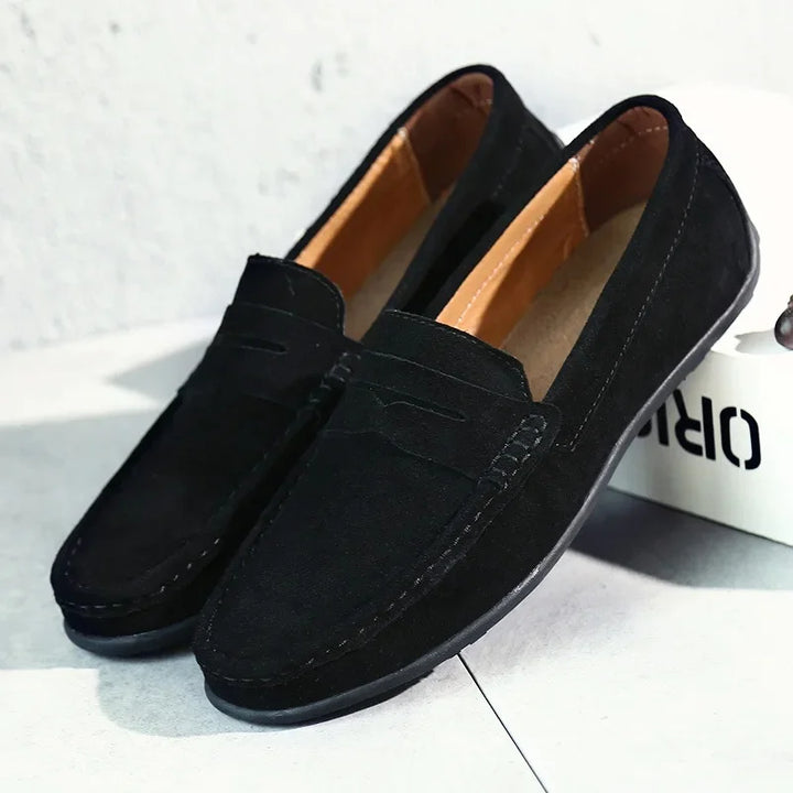Stylish men's navy penny loafers, easy slip-on shoes for smart casual spring/summer events and everyday wear.