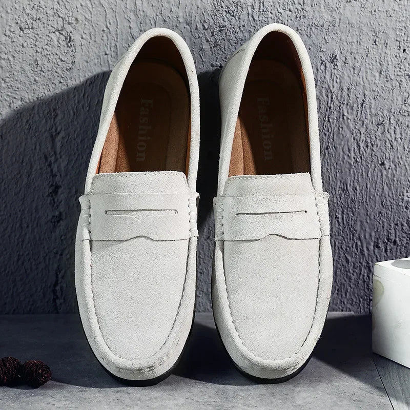 Stylish men's black slip-on penny loafers, ideal for smart casual wear or office, classic spring comfort.