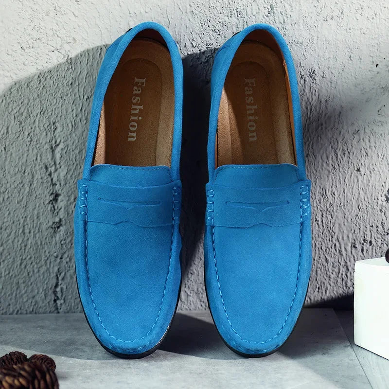 Front view of men's elegant blue suede penny loafers, comfortable slip-on shoes for spring/summer fashion.