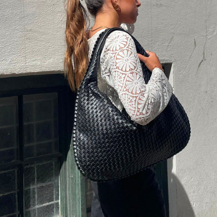 Elegant women's woven shoulder bag in chic vegan leather, perfect for daily use and fashion.