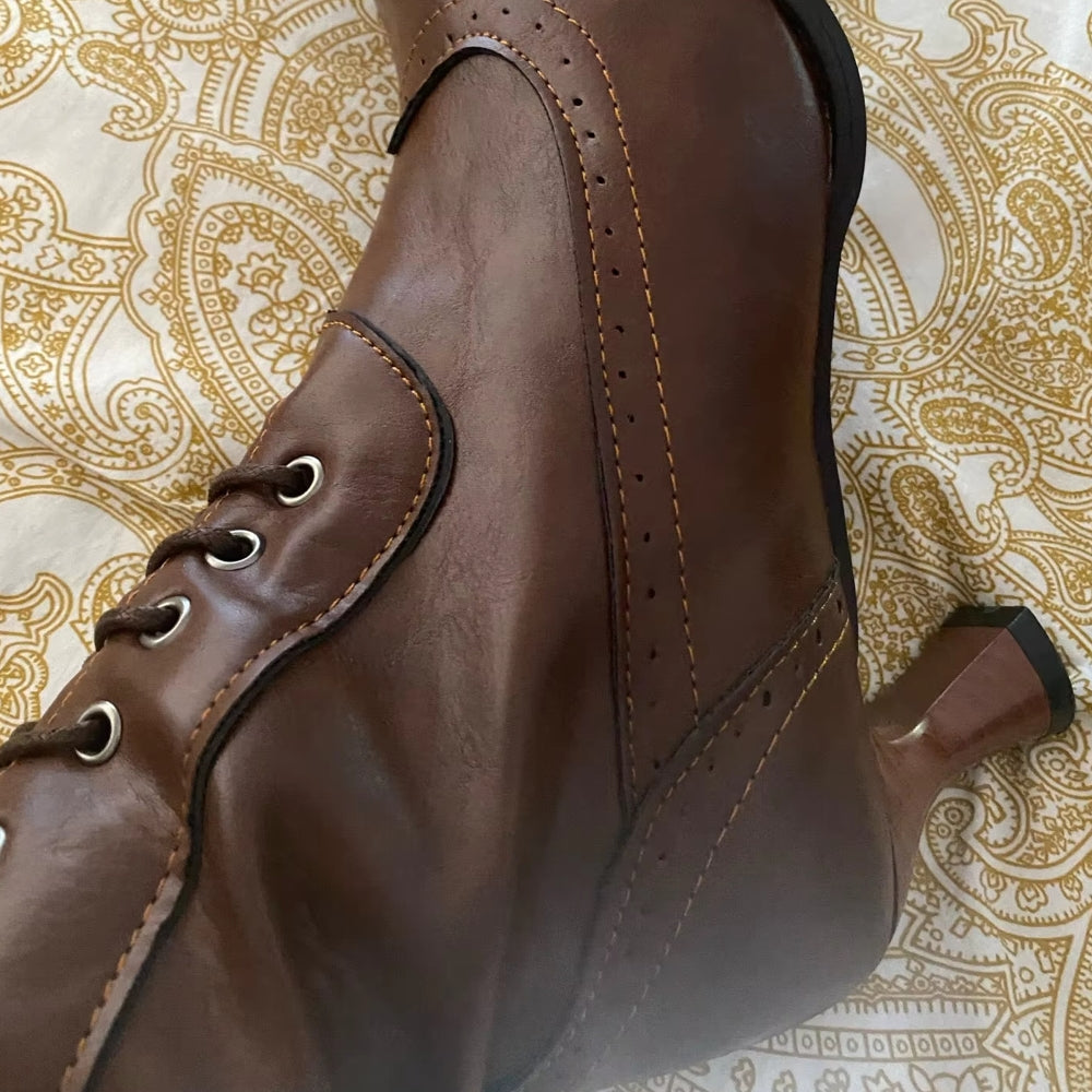 Close-up of women's retro high heel knight boots, showcasing unique detailing.