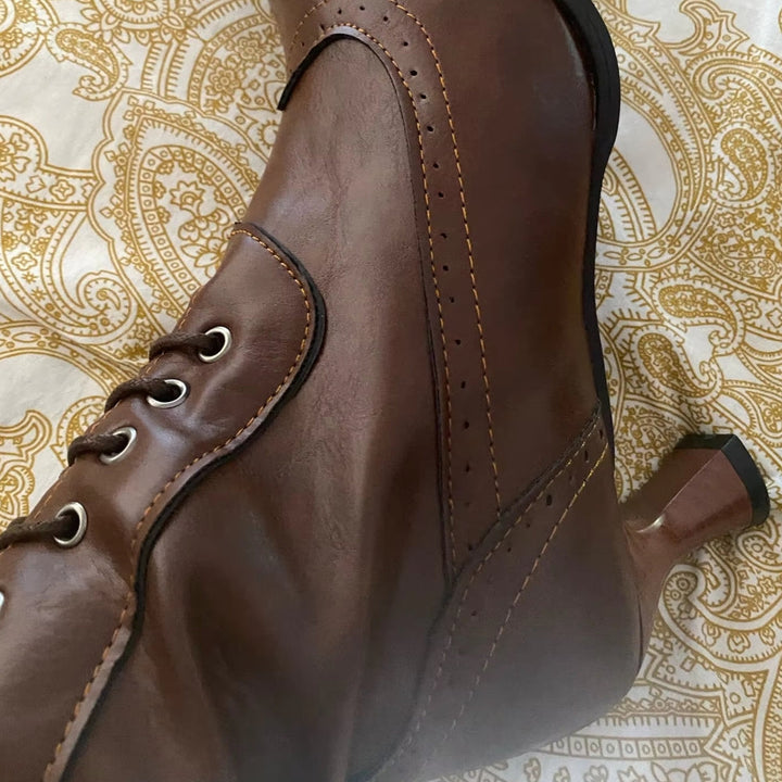 Close-up of women's retro high heel knight boots, showcasing unique detailing.
