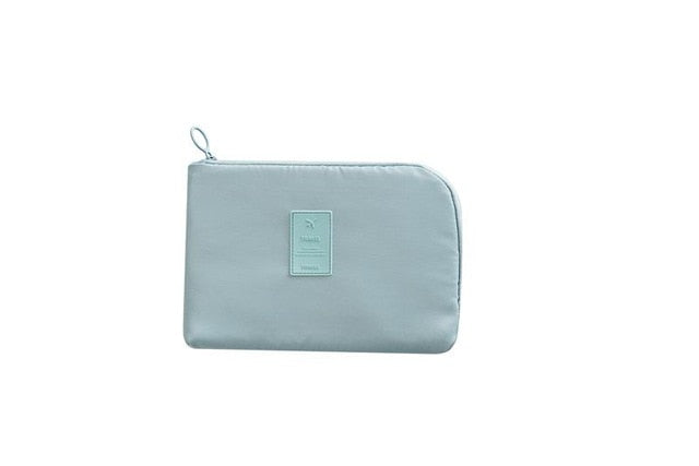Unisex compact tech travel organizer. Waterproof nylon pouch for electronics & gadget storage.