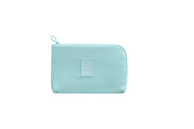 Waterproof electronics travel organizer. Keep cables & gadgets tidy with this compact nylon tech bag.
