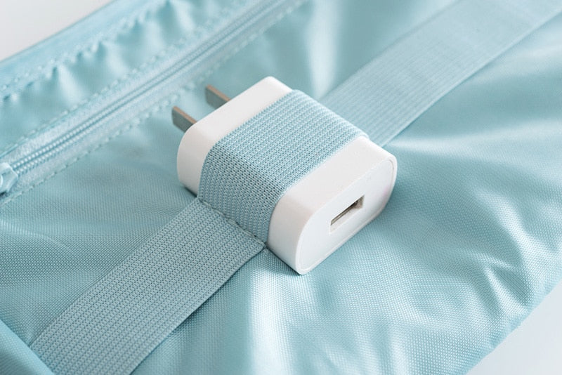 Compact travel organizer for electronics. Store chargers, USBs, and cables in this waterproof tech bag.