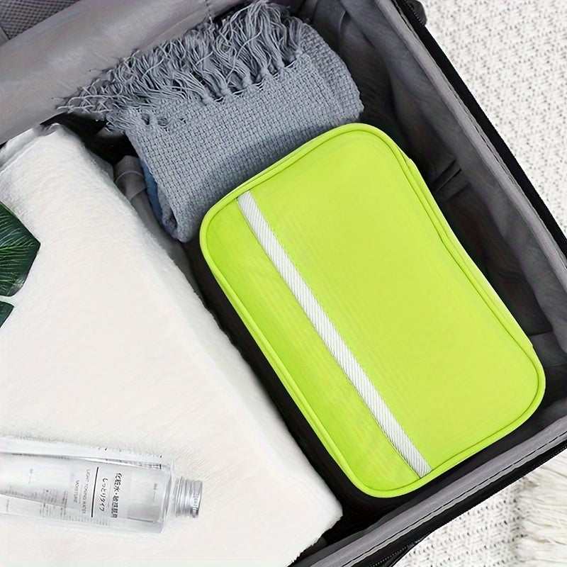 Open travel toiletry bag revealing multiple compartments, perfect for organizing all your travel essentials.