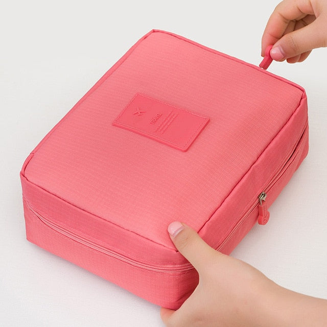 Stylish dark blue floral waterproof makeup organizer for women, compact & perfect for travel essentials.