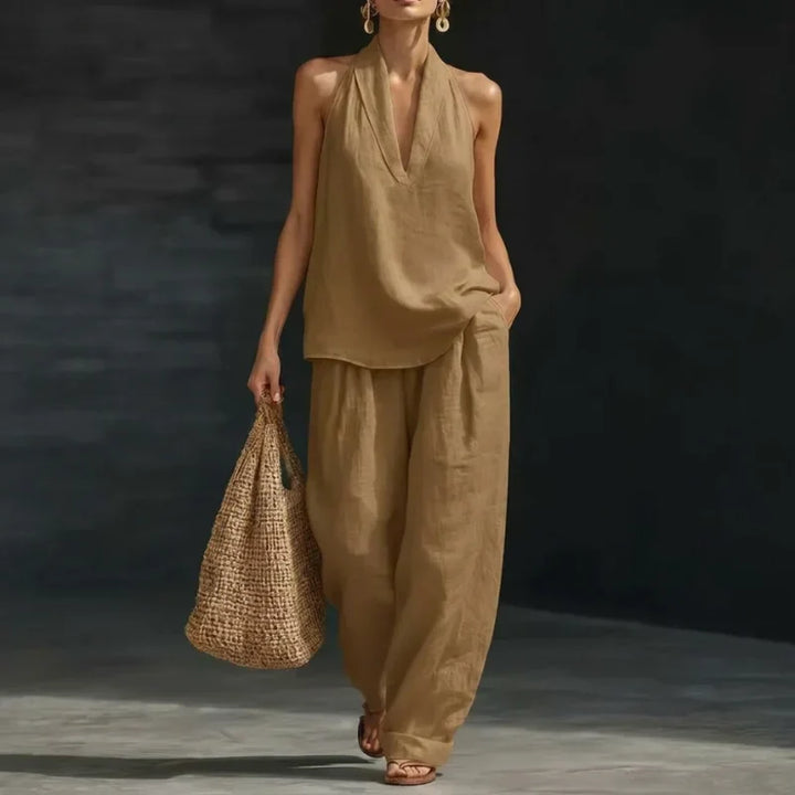 Effortless women's two-piece outfit: soft linen-look batwing top & flowy wide-leg pants. Great for summer.