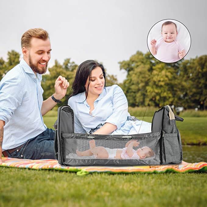 On-the-go convertible baby backpack with pop-out bassinet. Waterproof & multi-pocket for outdoor adventures with baby.
