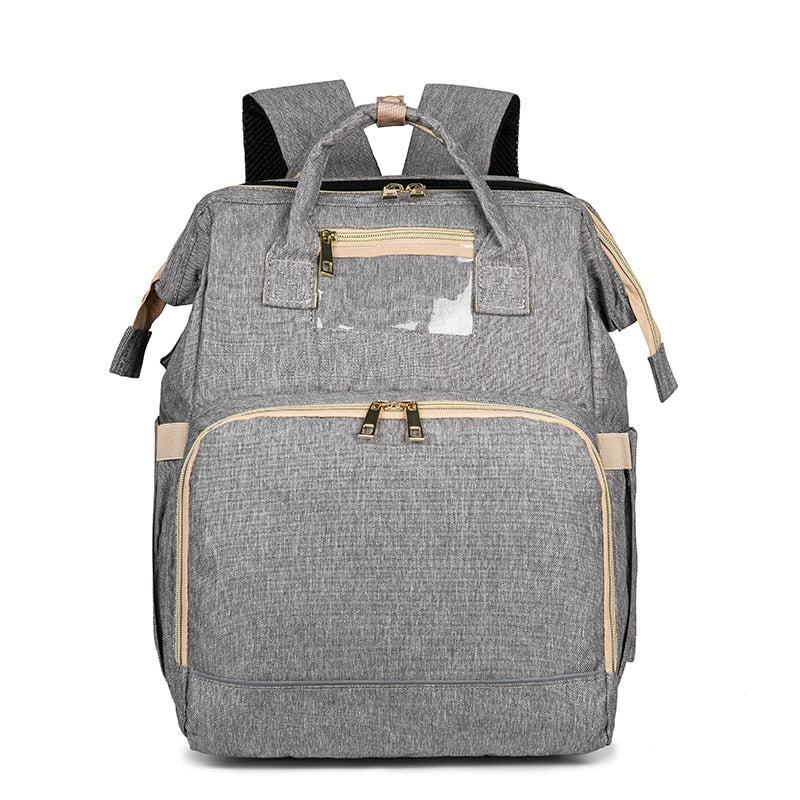 Versatile convertible diaper bag backpack. Features a secure foldable bassinet & multi-pocket organizer for baby essentials.