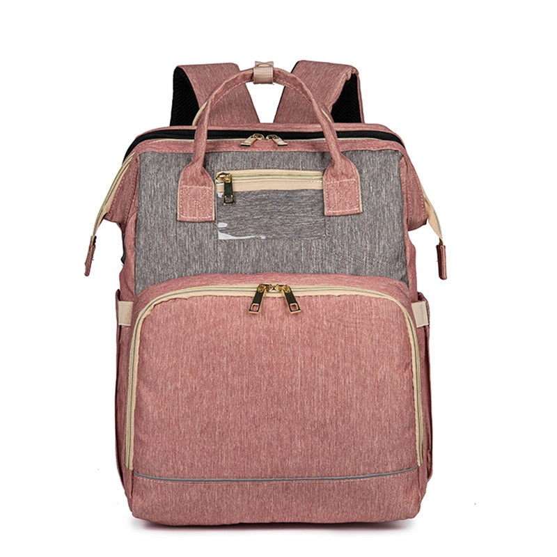 Multi-pocket convertible nappy backpack with integrated foldable bassinet. Keeps baby essentials organized & accessible.