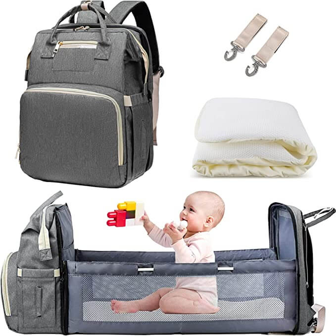 All-in-one parent bag: convertible nappy backpack, foldable bassinet, waterproof & organized for baby care essentials.