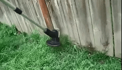 Cordless lightweight grass trimmer with ergonomic handle, high-power battery, and protective blade guard for efficient trimmi